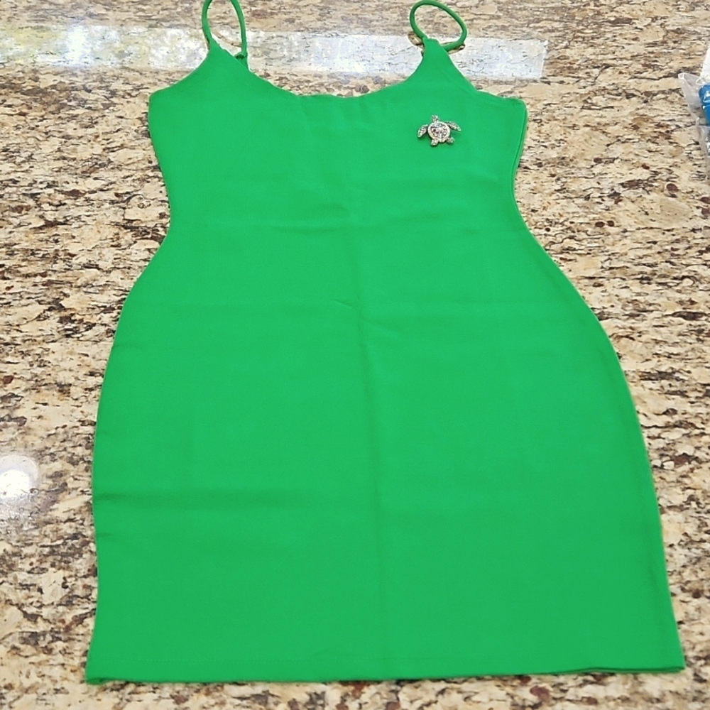 Green spaghetti strap dress with sea turtle pendent